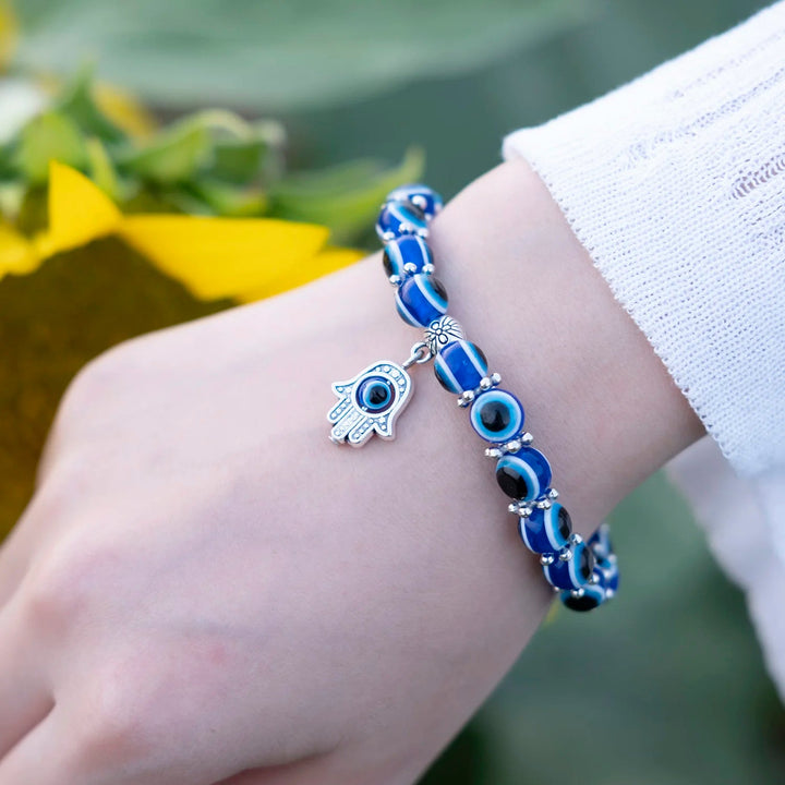 Delicate beaded Unisex Evil Eye protection anklet with blue charms, perfect symbolic jewelry.