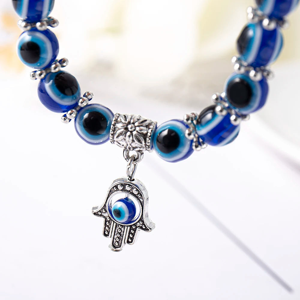 Foot wearing a subtle Unisex Evil Eye charm protection anklet, symbolizing good fortune & style.