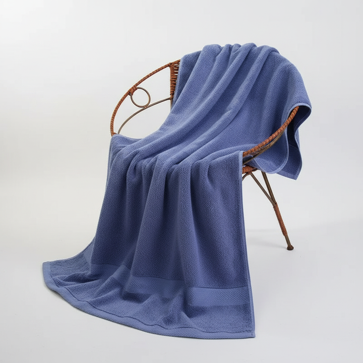 Unisex extra large RoyalTowel bath towel draped, showing quick-dry cotton fabric