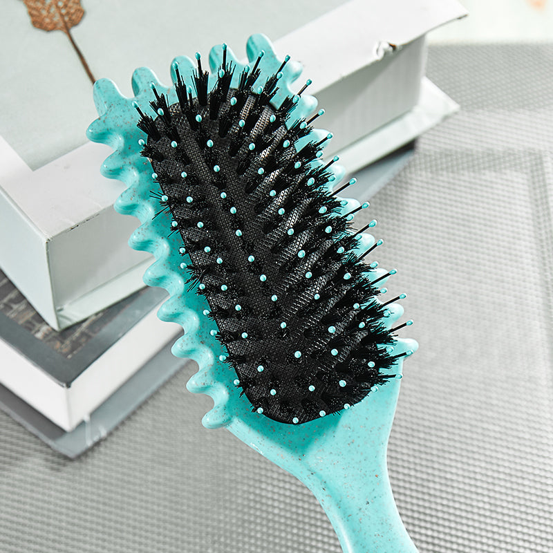 Ergonomic unisex hair brush with vent design for rapid drying & frizz reduction.