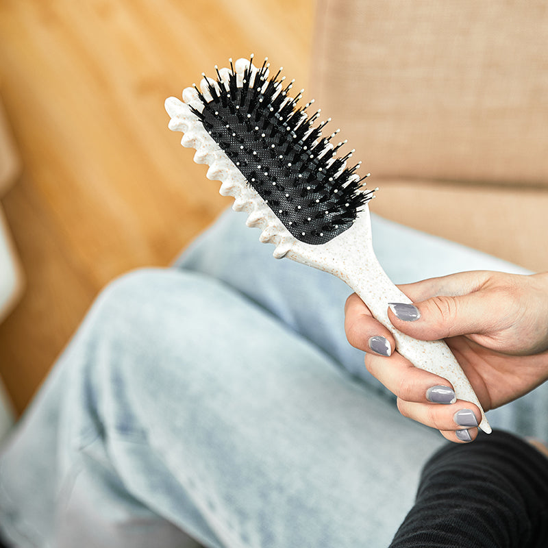 Detangling vent brush for fast drying & frizz control, ideal for daily hair care.
