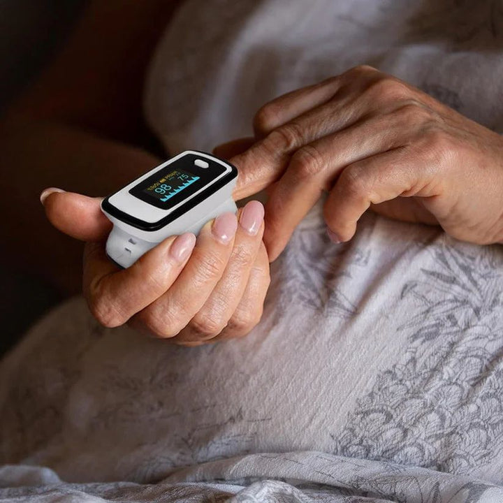 Unisex finger pulse oximeter with clear LED display for oxygen saturation & pulse rate. Portable health tracker.