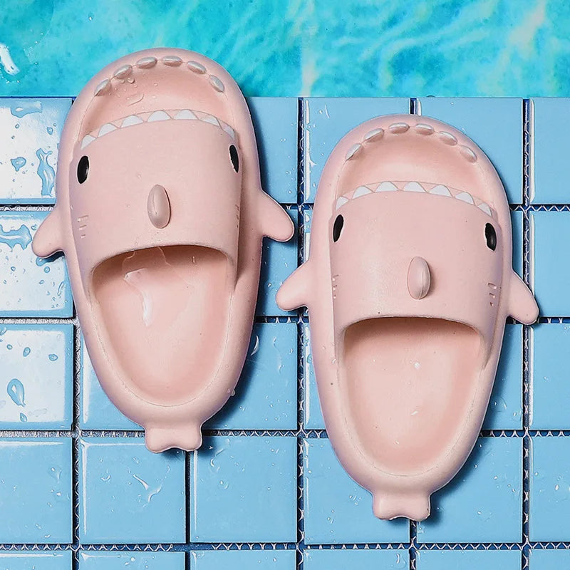 Foot wearing a single FinSteps shark flip flop, showing the secure strap and soft, lightweight construction.