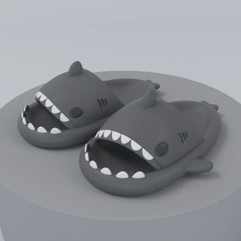 Close-up of FinSteps shark design flip flops, showing detailed fin strap & comfortable sole for beachwear.