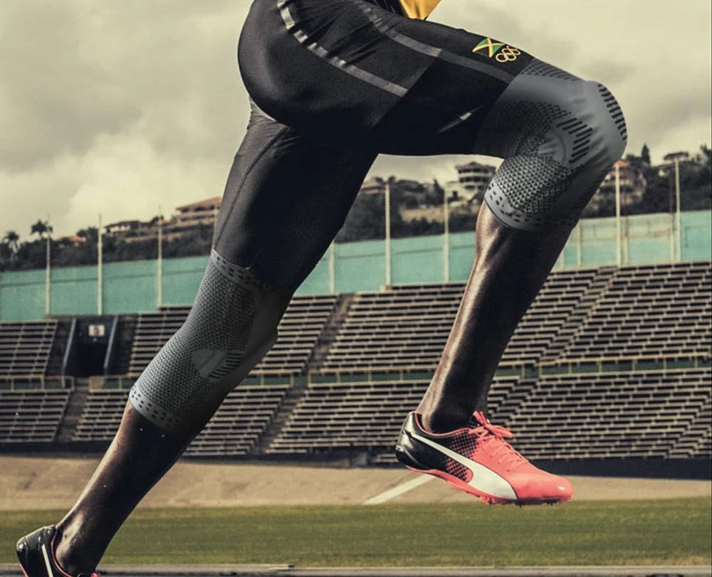 Supportive knee brace worn on a leg, providing joint stability, compression & pain relief for sports injury recovery.