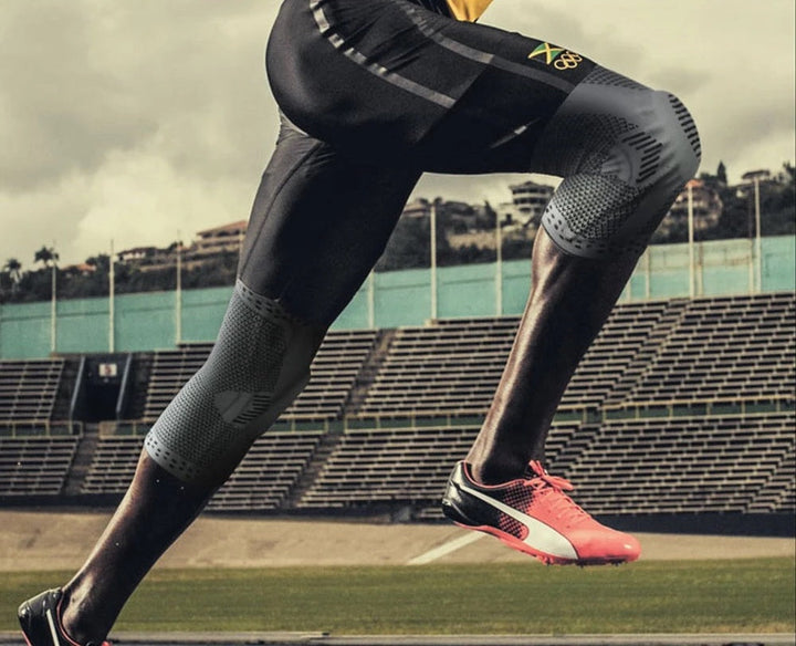 Supportive knee brace worn on a leg, providing joint stability, compression & pain relief for sports injury recovery.