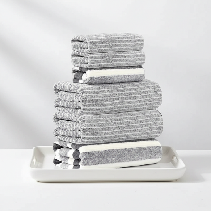 Closeup of a folded coral fleece bath towel, showing its fluffy texture and thickness