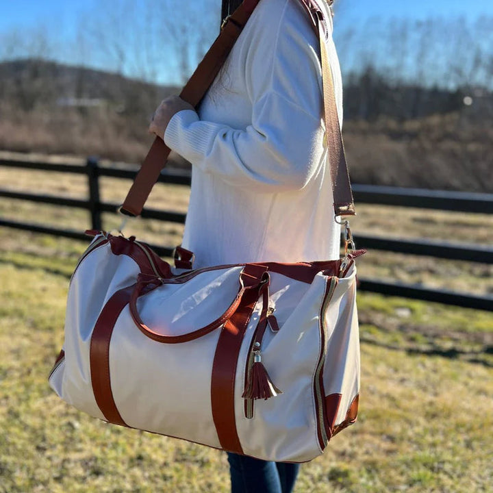 Unisex foldable garment travel bag for suits & dresses, ensuring wrinkle-free clothing during transit.