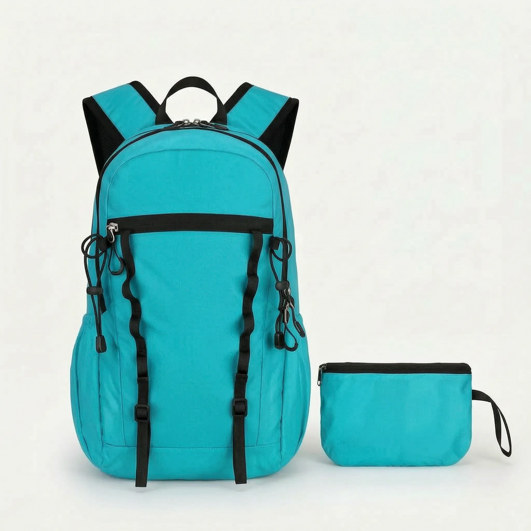 Back of a lightweight hiking daypack with breathable mesh straps for comfortable wear.