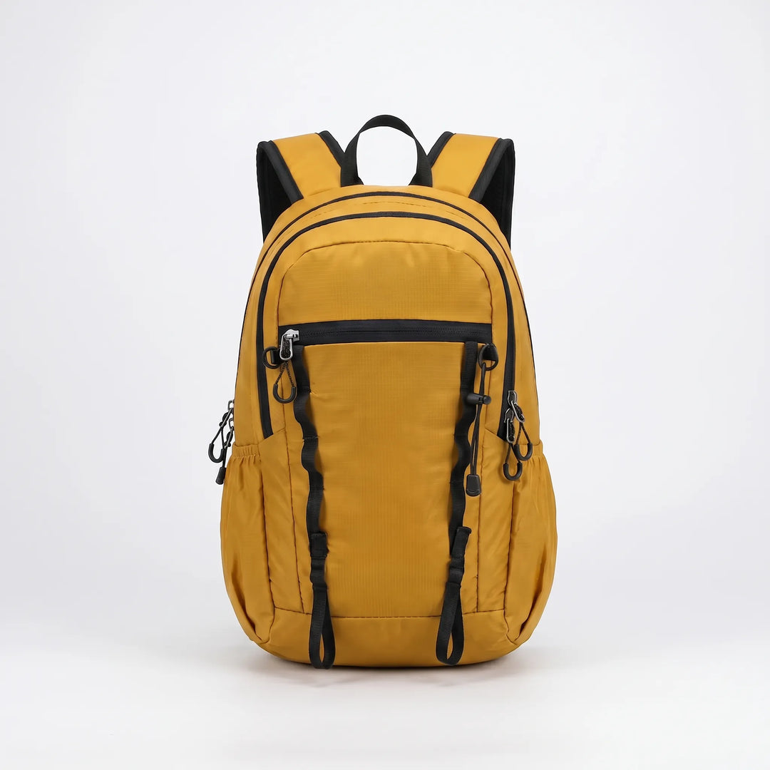 Folded compact hiking daypack, ideal for space-saving travel, camping, or daily use.