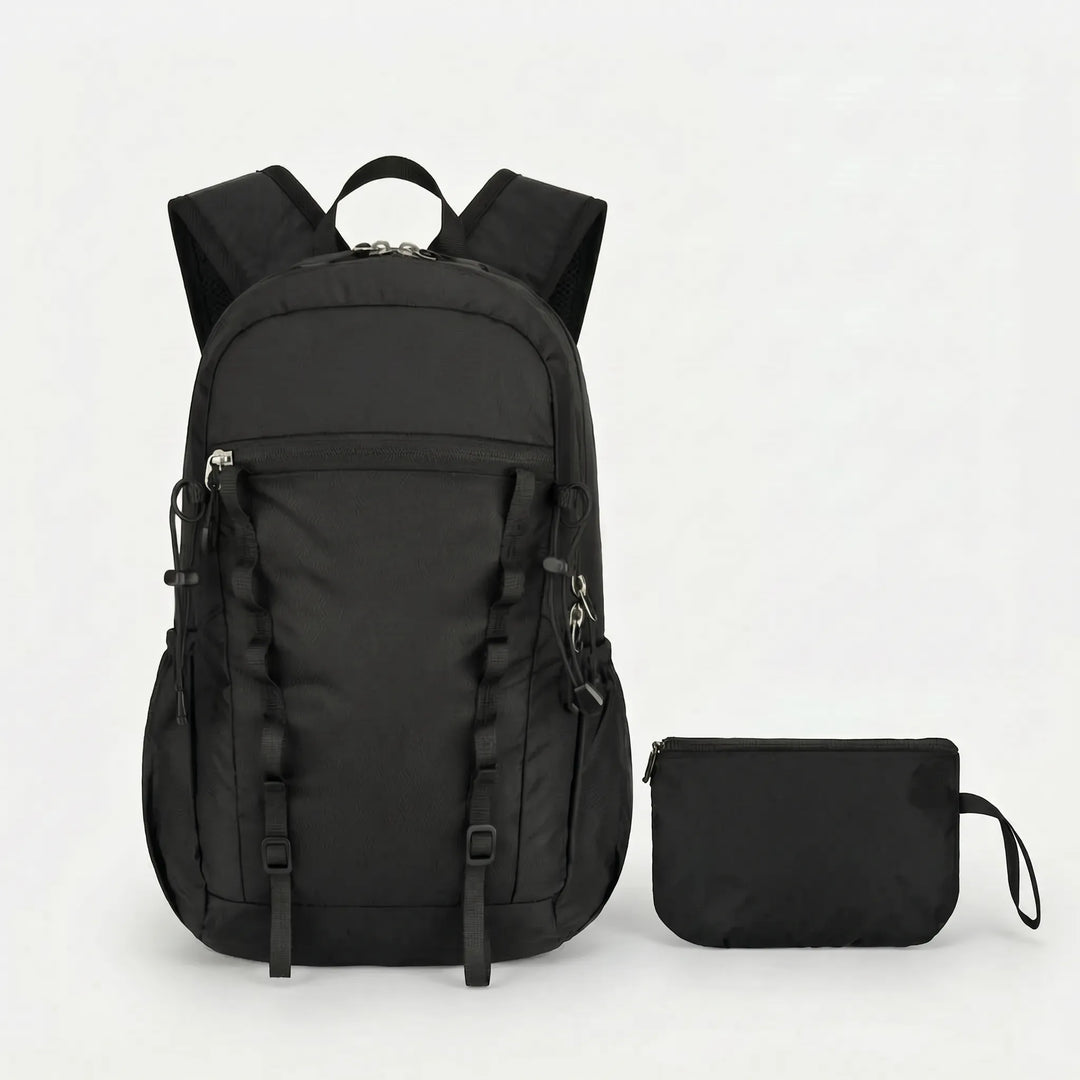 Side view of a unisex foldable daypack with water bottle pocket, practical for outdoor activities.