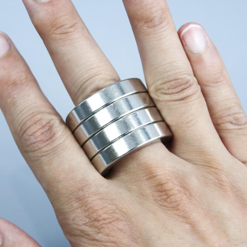 Unisex folding anxiety ring for stress relief, a portable four-finger fidget tool designed for focus and calming.