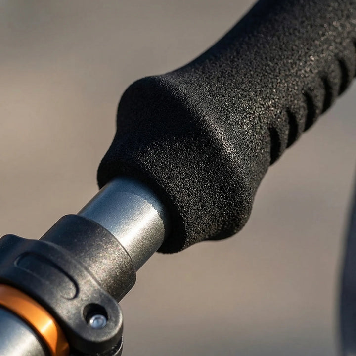 Adjustable hiking pole in extended use, providing sturdy support for trekking, trails & outdoor adventures.
