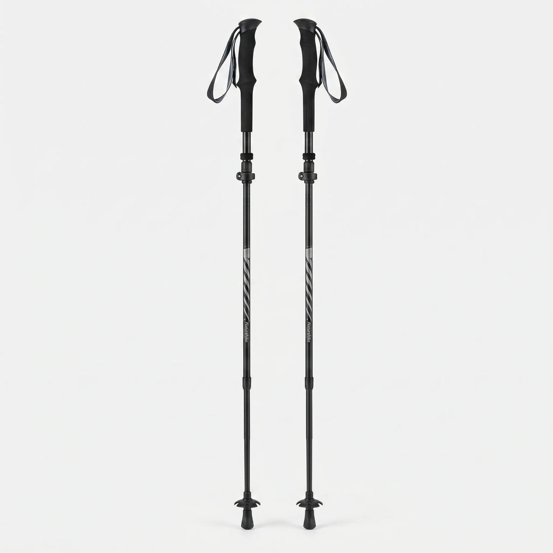 Pair of unisex folding trekking poles, lightweight & adjustable for all hikers on mountain & trail adventures.