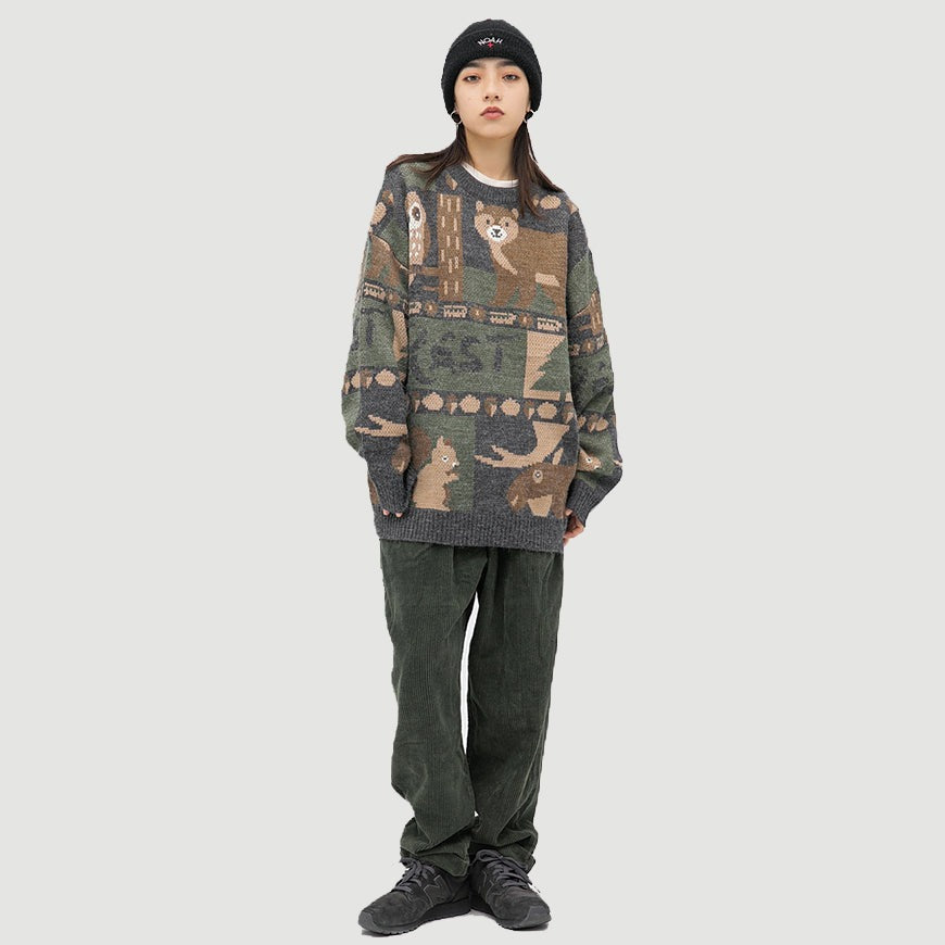 Casual cozy unisex sweater featuring a vintage Forest Friends animal print. Long sleeve, round neck pullover style.