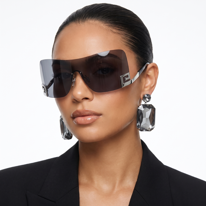 Unisex frameless futuristic sunglasses with UV400 protection. Sleek, modern eyewear for fashion-forward individuals.