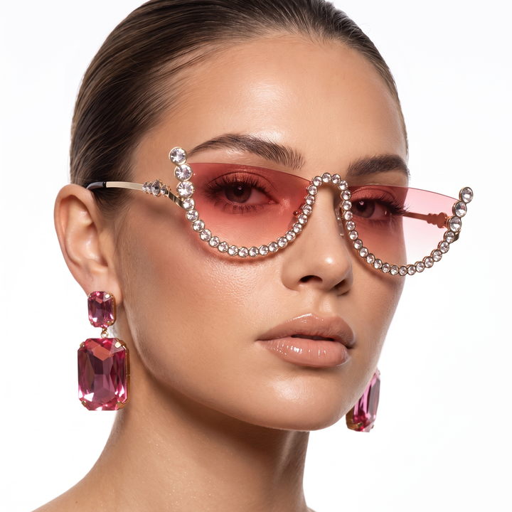 Fashionable pink frameless oval sunglasses, unisex UV400 eyewear for stylish sun protection.
