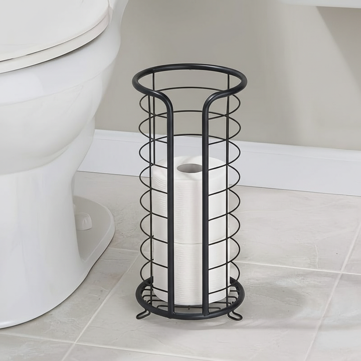 Unisex freestanding toilet paper holder in brushed stainless steel, modern bathroom accessory with sturdy base.