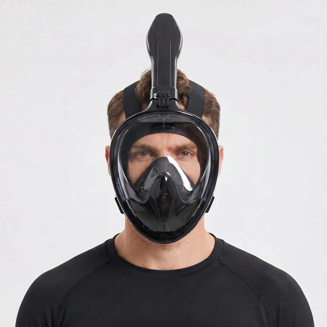 Diver exploring marine life with a full-face snorkel mask, offering a wide panoramic underwater view.