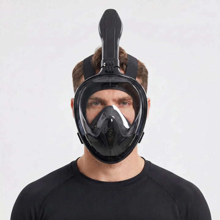 Diver exploring marine life with a full-face snorkel mask, offering a wide panoramic underwater view.