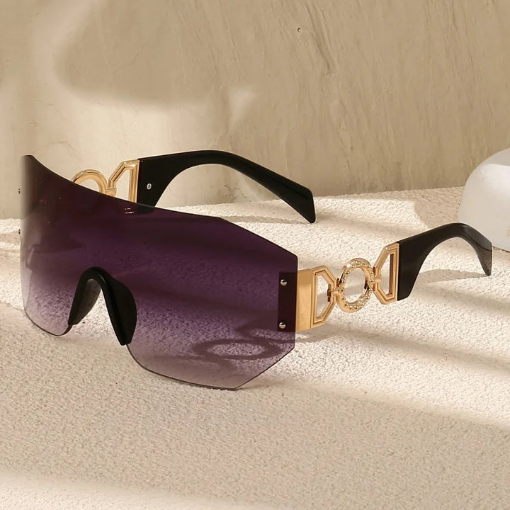 Bold futuristic unisex sunglasses featuring colorful gradient lenses, gold temples, and UV400 protection.