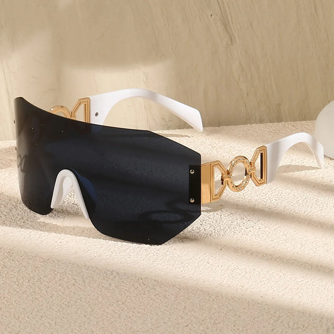 Statement futuristic unisex shades with vibrant gradient lenses offering full UV400 protection for your eyes.