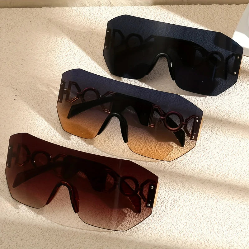 Futuristic unisex sunglasses with vibrant colorful gradient lenses & sleek gold temples for bold style. UV400.