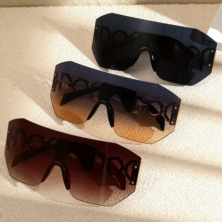 Futuristic unisex sunglasses with vibrant colorful gradient lenses & sleek gold temples for bold style. UV400.
