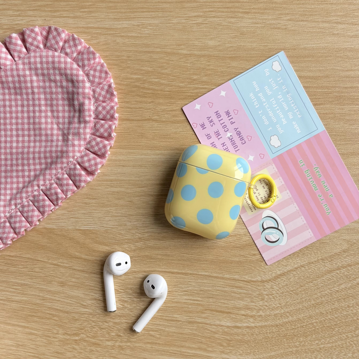 Unisex glossy polka dot earphone case with ring for AirPods. Protective, portable earbuds cover.