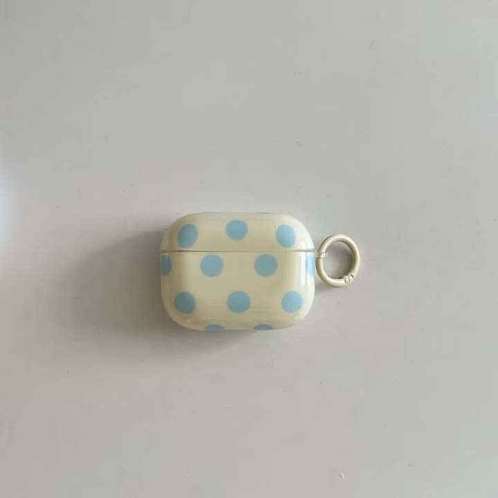 Fashionable glossy polka dot AirPods case. Unisex protective earphone cover with a convenient ring.
