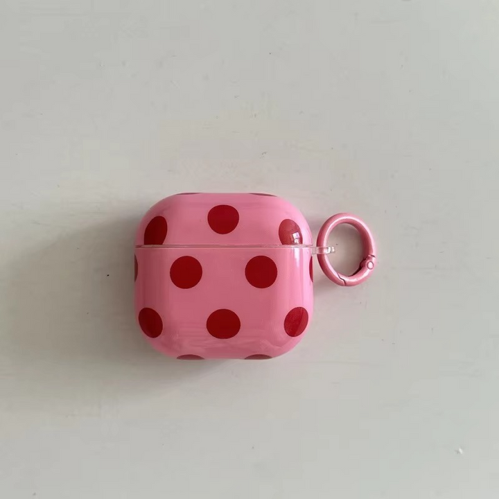 Wireless earbuds accessory: glossy polka dot AirPods case with ring. Protective, portable, & stylish unisex.