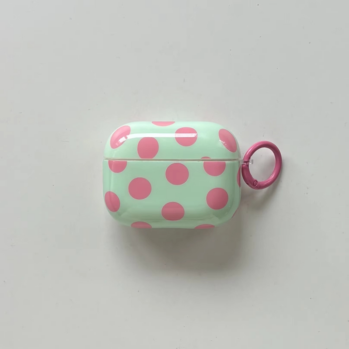 Modern glossy polka dot earphone cover with ring for AirPods. Protective, portable, & unisex tech fashion.