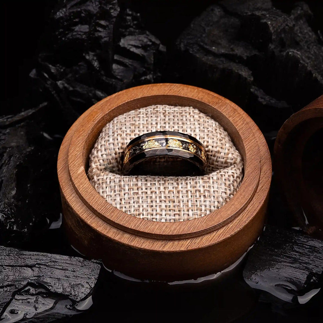Black gold-toned unisex tungsten ring, featuring a vibrant golden leaf and meteorite inlay.