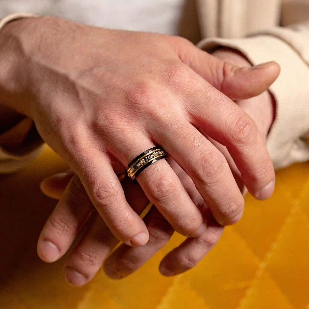 Elegant Black Meteorite Tungsten Ring with golden leaf detail, a perfect unisex accessory.