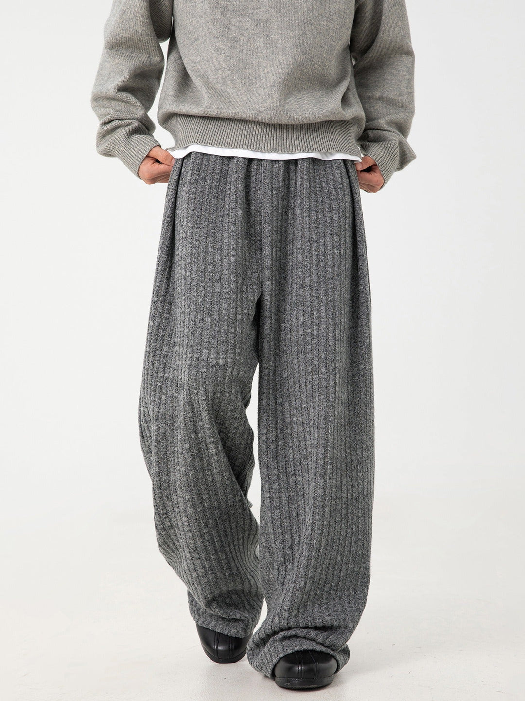 Gray athleisure joggers for men & women, offering cloud-soft comfort, 4-way stretch, great for lounging.