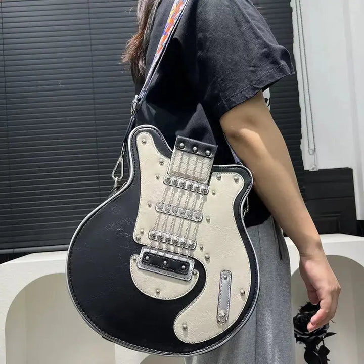 Novelty guitar shaped crossbody bag, a playful and unique accessory.