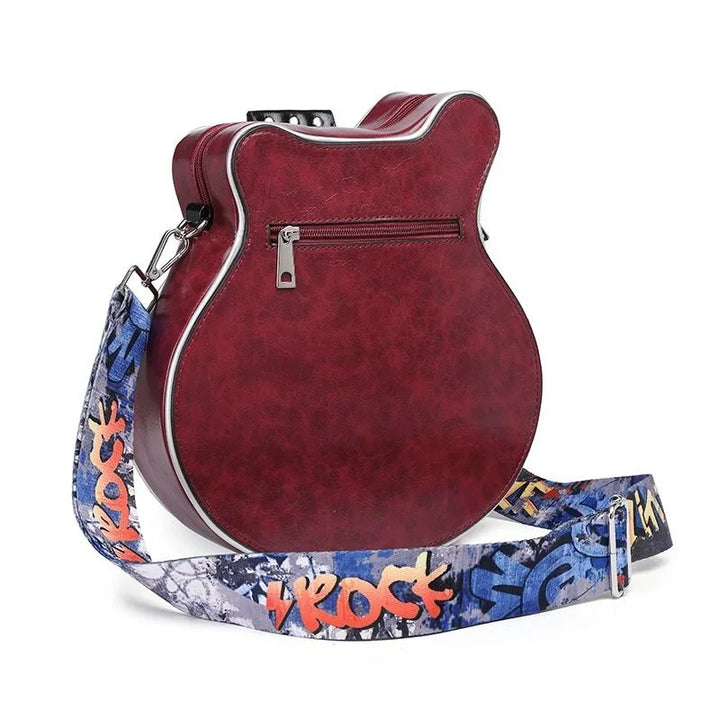 Black guitar shaped shoulder bag, a distinctive fashion statement accessory.