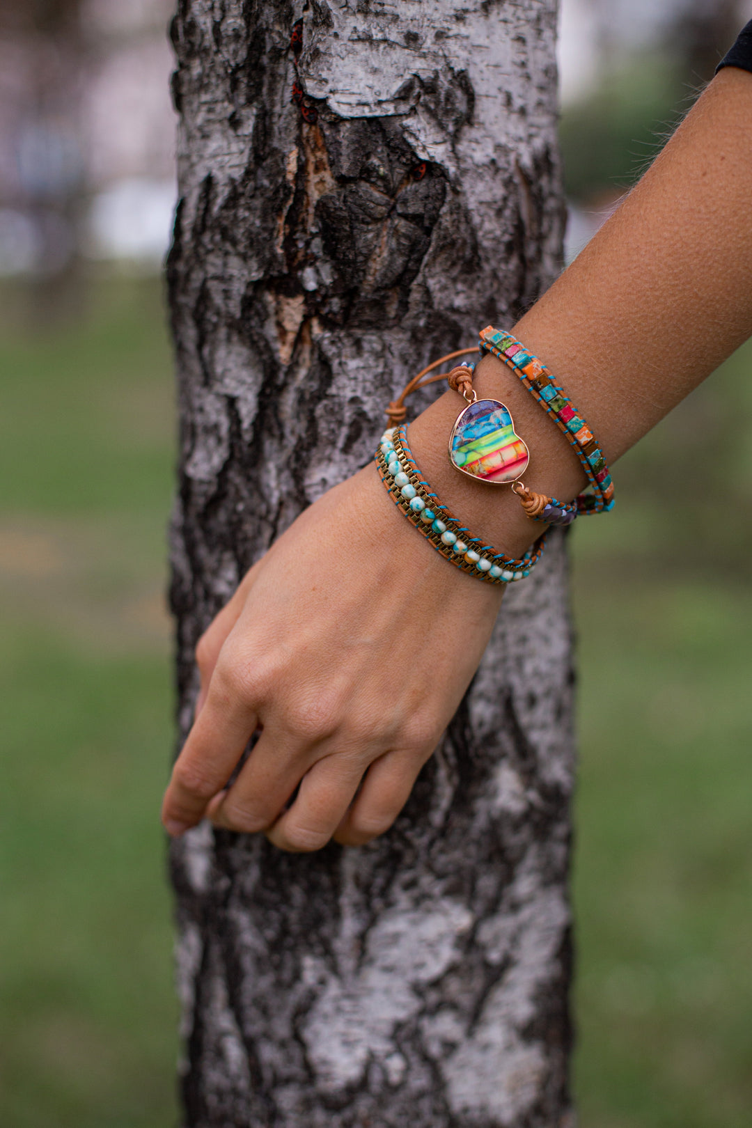Close-up of unisex chakra energy wrap bracelet with crystal and jasper stones