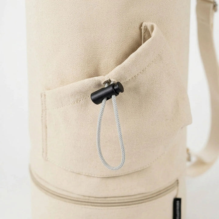 Black unisex yoga mat bag, hands-free carrying, ideal for studio and outdoor workouts.
