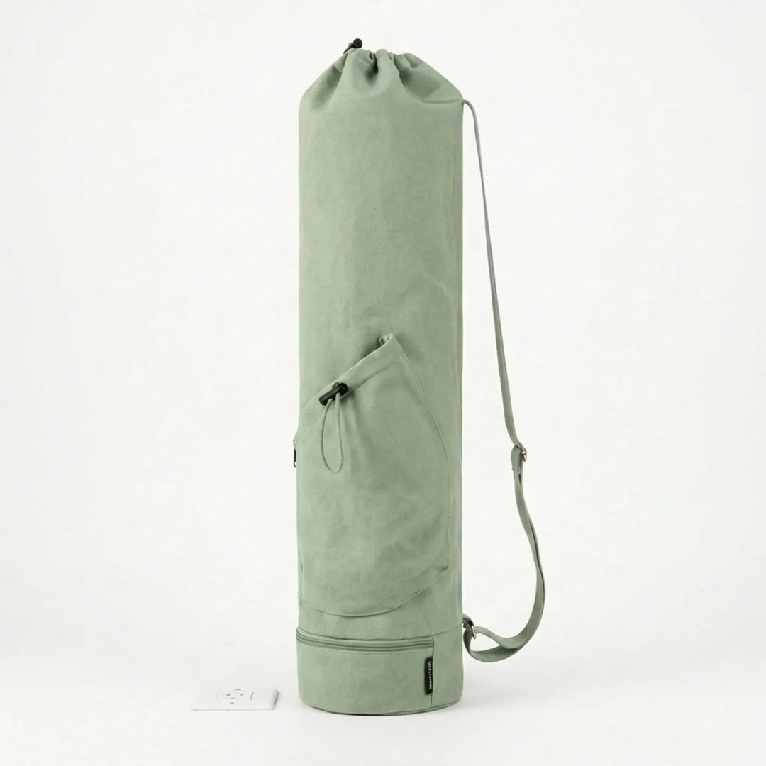 Spacious yoga mat carrier bag with external pockets for water bottle & personal essentials.