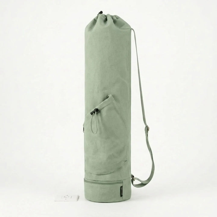 Spacious yoga mat carrier bag with external pockets for water bottle & personal essentials.