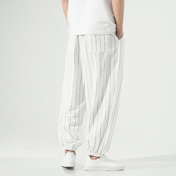 Relaxed fit unisex harem pants. Pinstripe joggers offering comfort and style for casual everyday fashion.