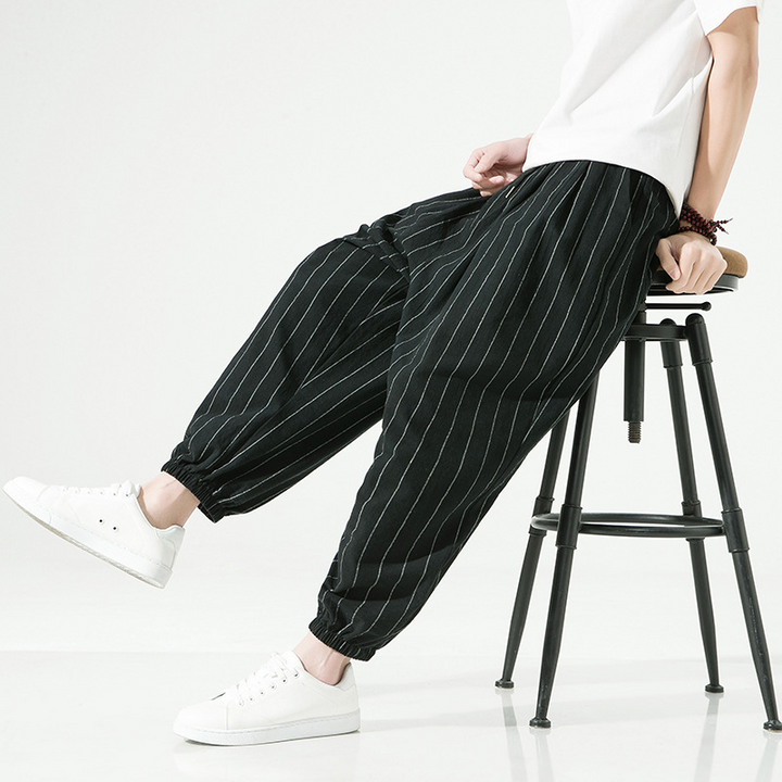 Relaxed fit linen blend pinstripe harem joggers for ultimate comfort. Unisex style with drawstring.