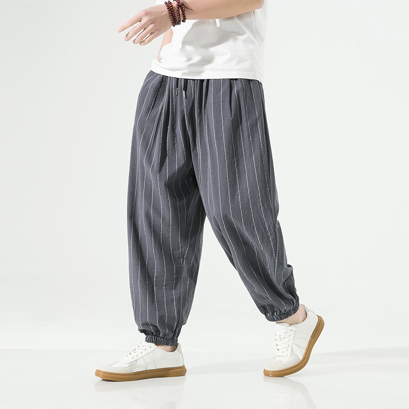 Comfortable unisex pinstripe harem pants. Stylish joggers with a relaxed fit, great for casual wear.