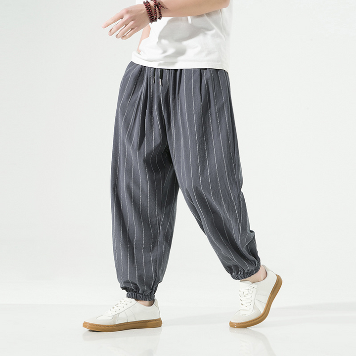 Comfortable unisex pinstripe harem pants. Stylish joggers with a relaxed fit, great for casual wear.
