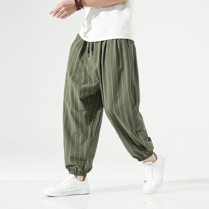 Everyday wear unisex harem joggers. Comfortable relaxed fit pinstripe pants with adjustable drawstring.