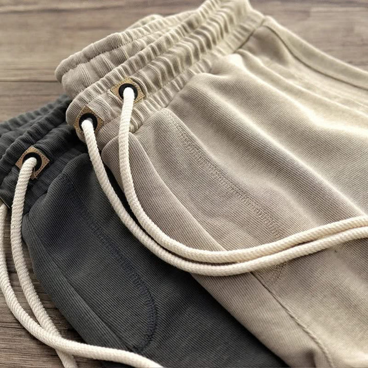Harlan relaxed fit gym shorts featuring adjustable drawstring waist for secure, comfortable active wear.