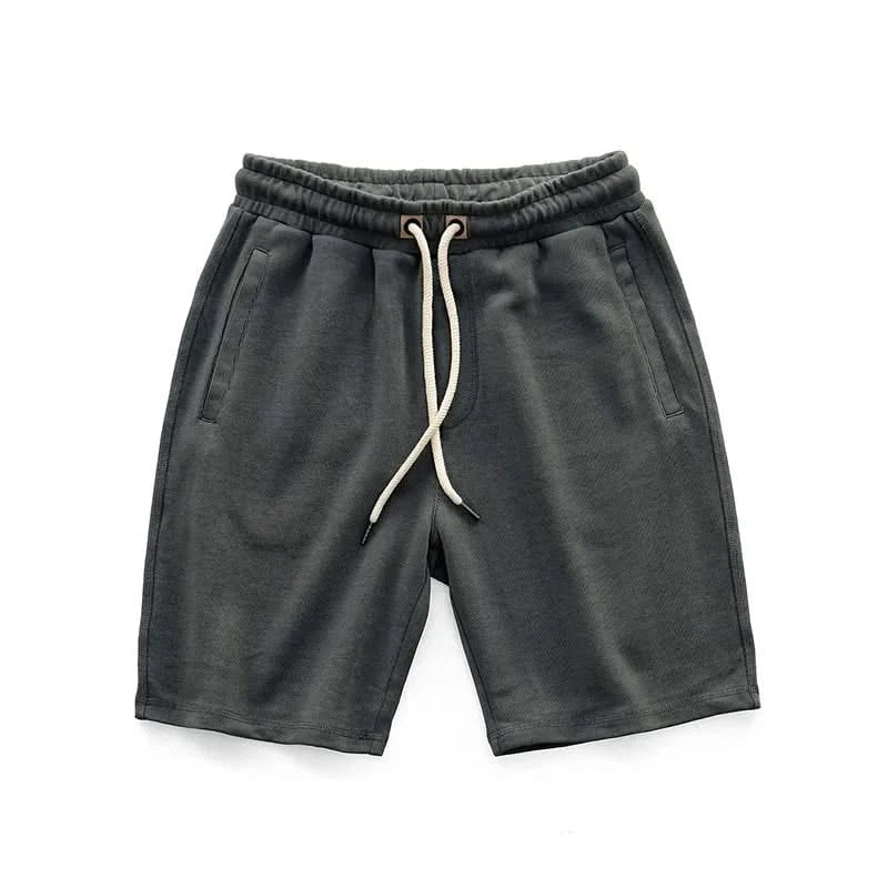 Close-up of Harlan unisex gym shorts fabric, showing breathable material for active & exercise wear.