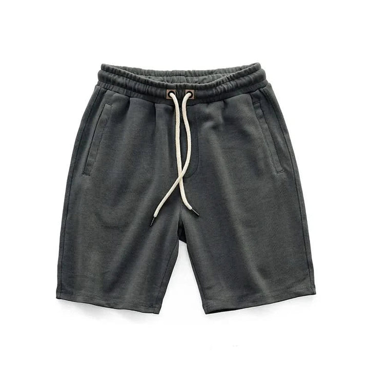 Close-up of Harlan unisex gym shorts fabric, showing breathable material for active & exercise wear.