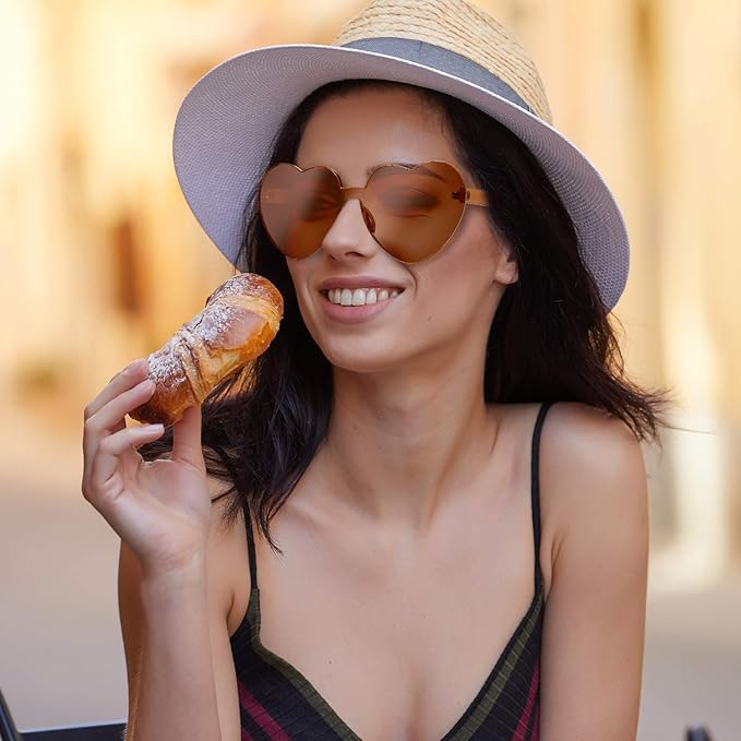 Fashion accessory: rimless heart-shaped transparent sunglasses for a chic and playful vibe.
